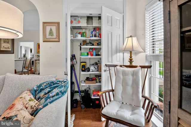 a view of walk in closet with clothes