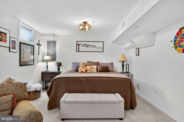 a bedroom with furniture and a chandelier