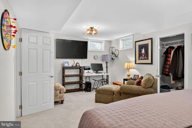 a living room with furniture and a lamp