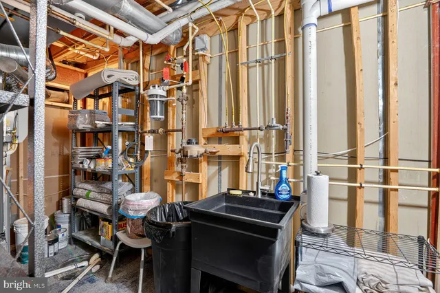 a view of a patio with table and chairs potted plants with wooden floor and fence