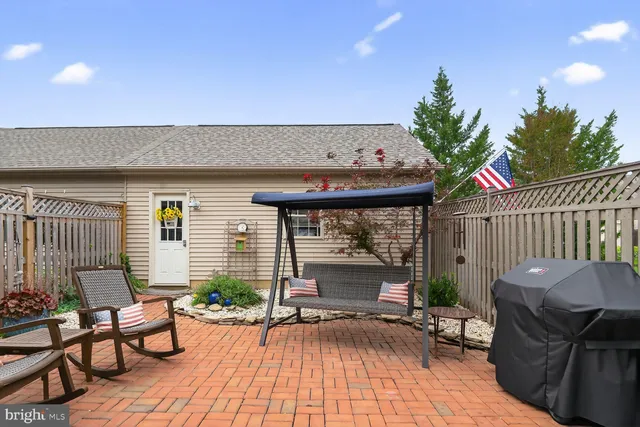 a balcony with table and chairs