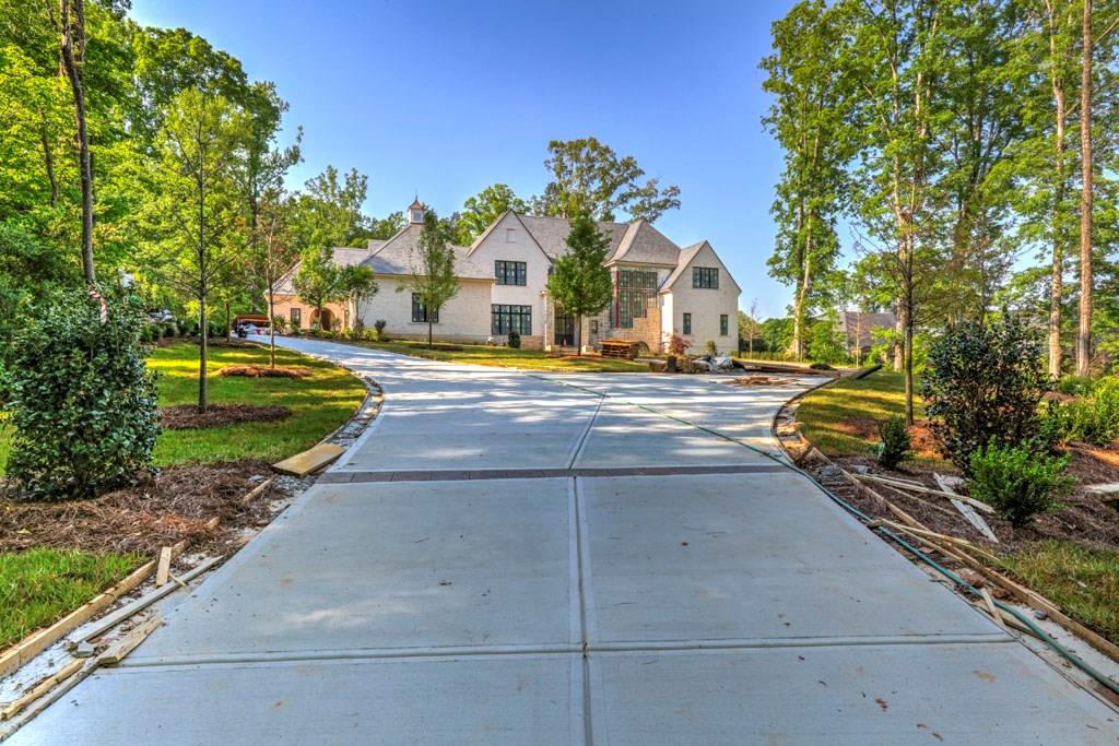 a view of road with large trees