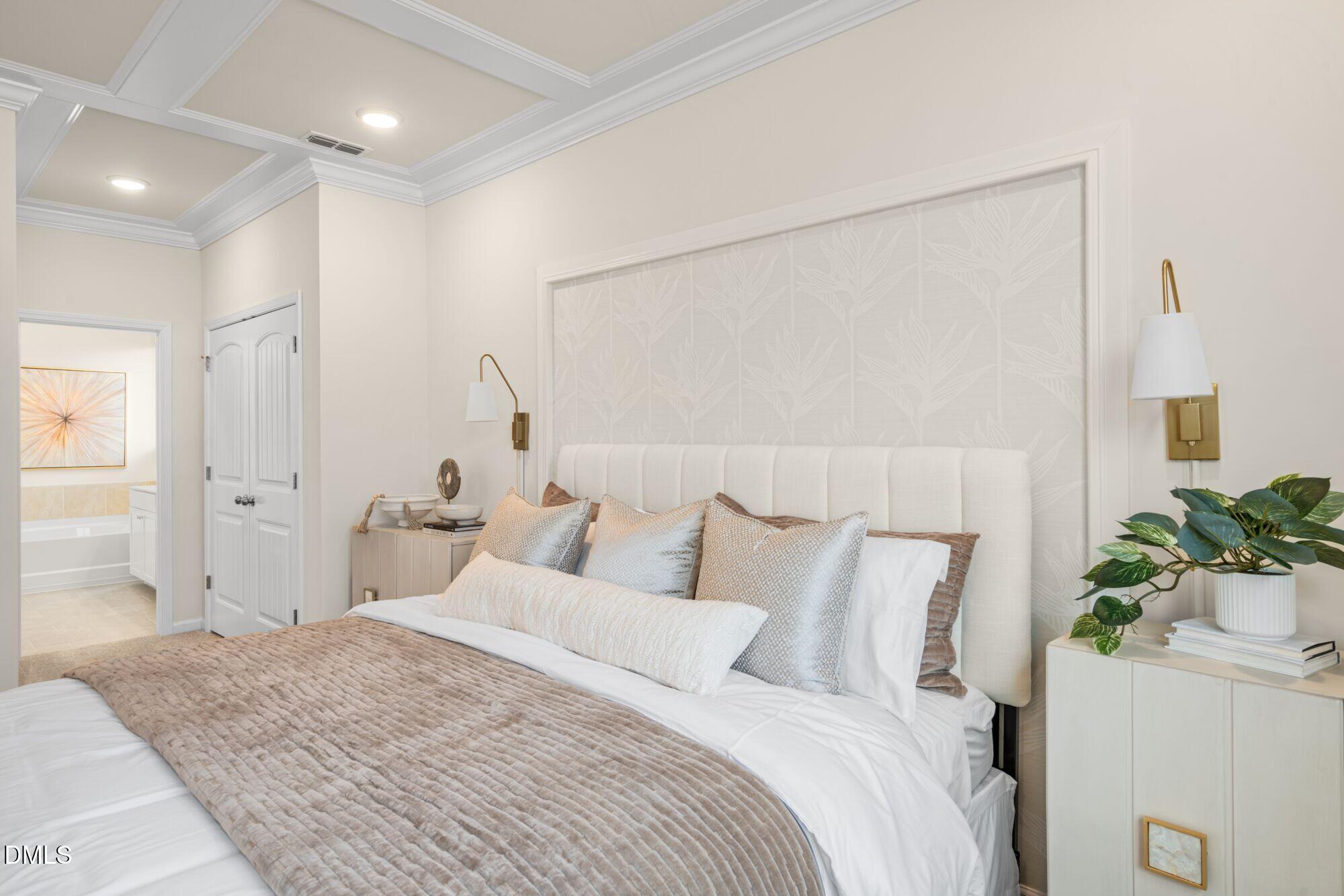 108 Vulcan Street Garner, NC 27529 - Photo 11 of 22 a bedroom with a bed and a potted plant