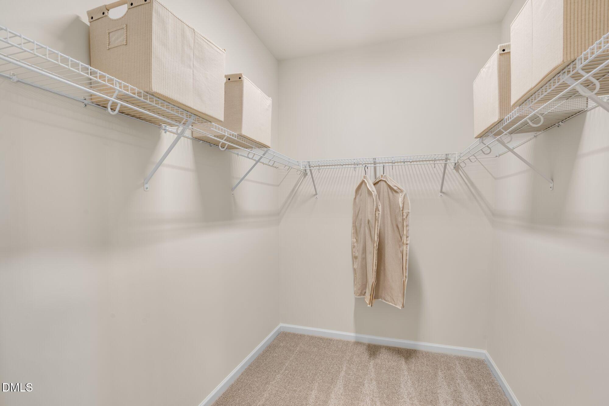 108 Vulcan Street Garner, NC 27529 - Photo 10 of 22 a view of walk in closet with clothes