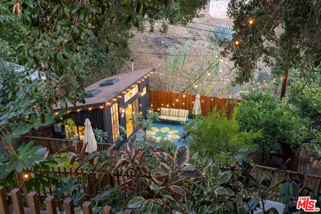 a view of a patio with couches chairs and a fire pit