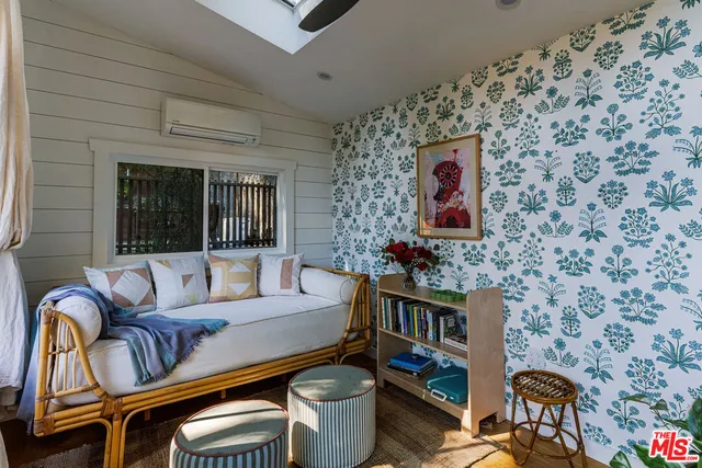 a bathroom with a bathtub and a window