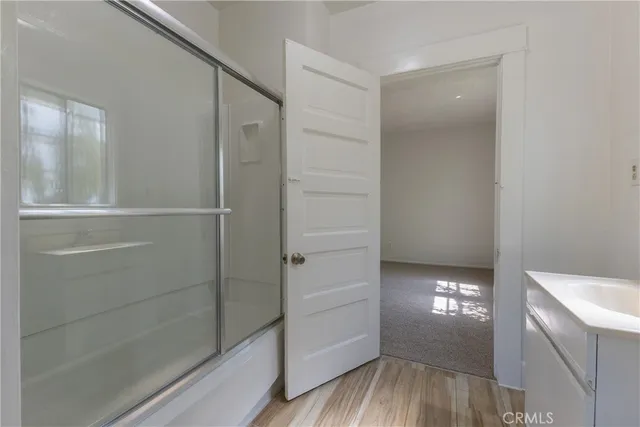 a bathroom with a bathtub and shower