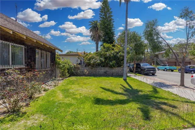 a swimming pool with outdoor seating and yard