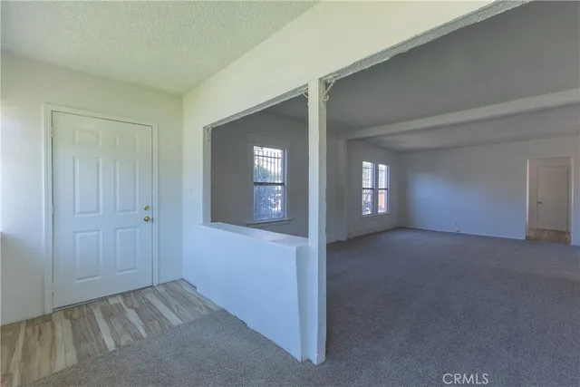a view of an empty room and window