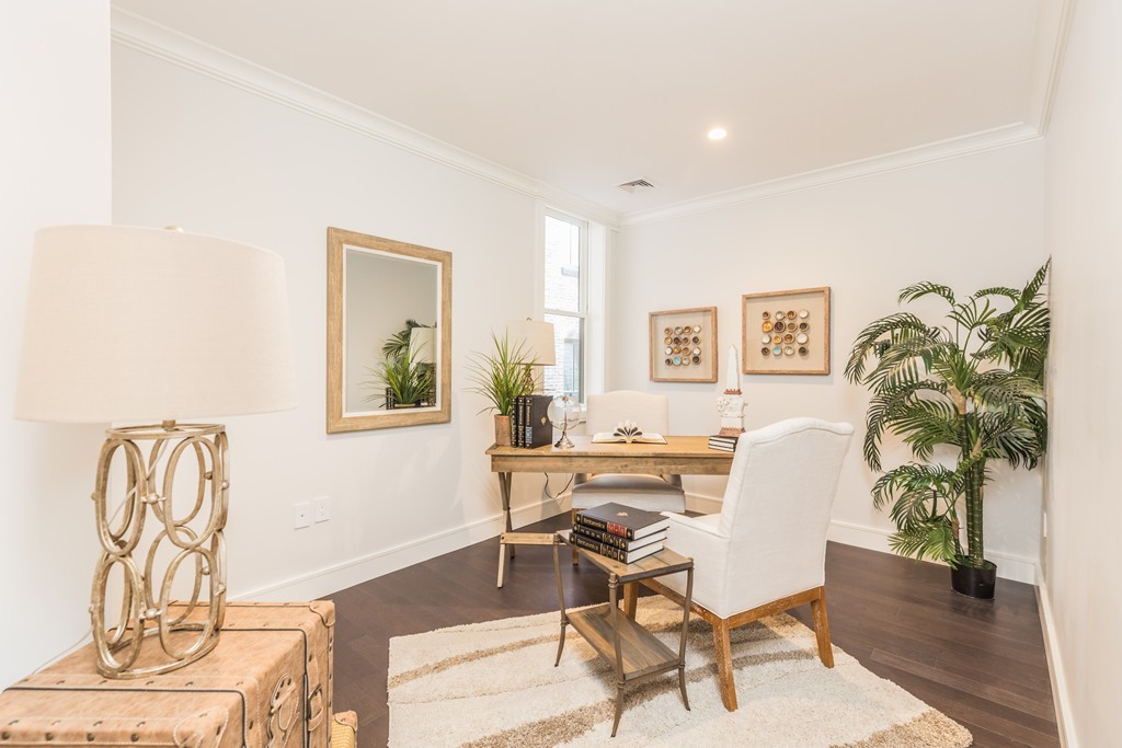 11 Exeter Street, Unit 3 Boston, MA 02116 - Photo 13 of 17 a view of a livingroom with furniture and a potted plant
