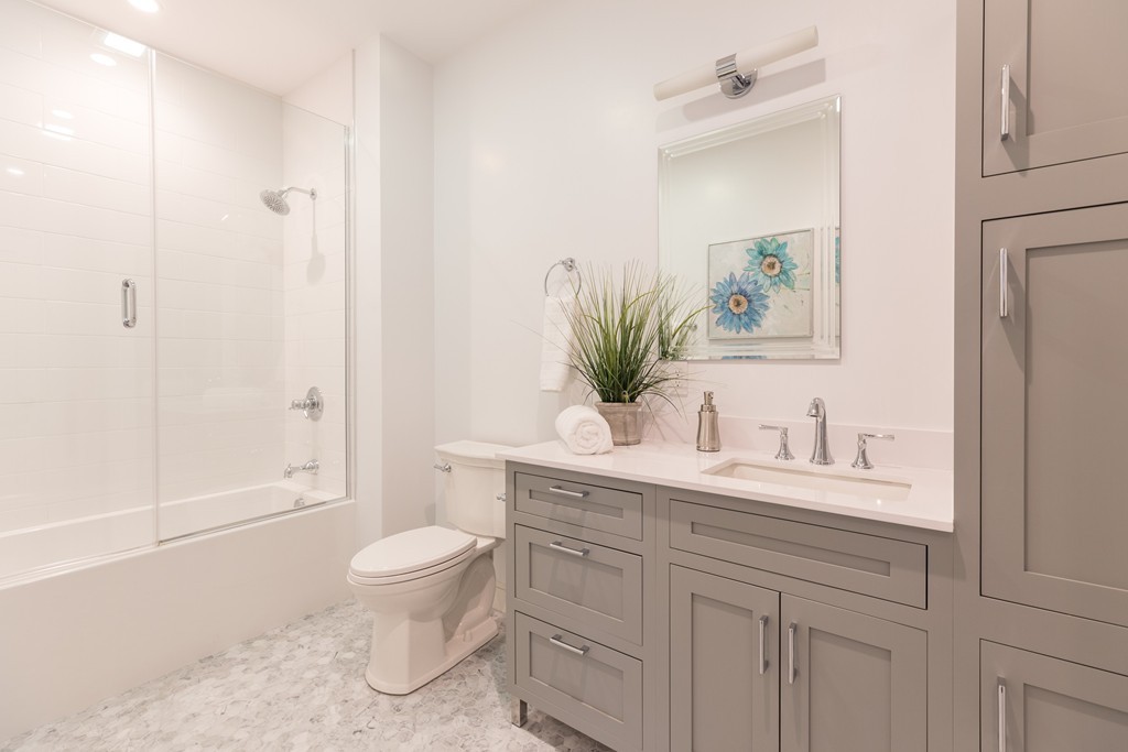 11 Exeter Street, Unit 3 Boston, MA 02116 - Photo 14 of 17 a bathroom with a sink a toilet and shower