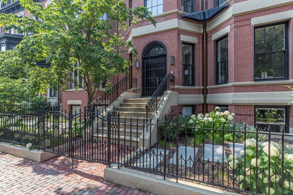 11 Exeter Street, Unit 3 Boston, MA 02116 - Photo 16 of 17 a front view of a house with a garden