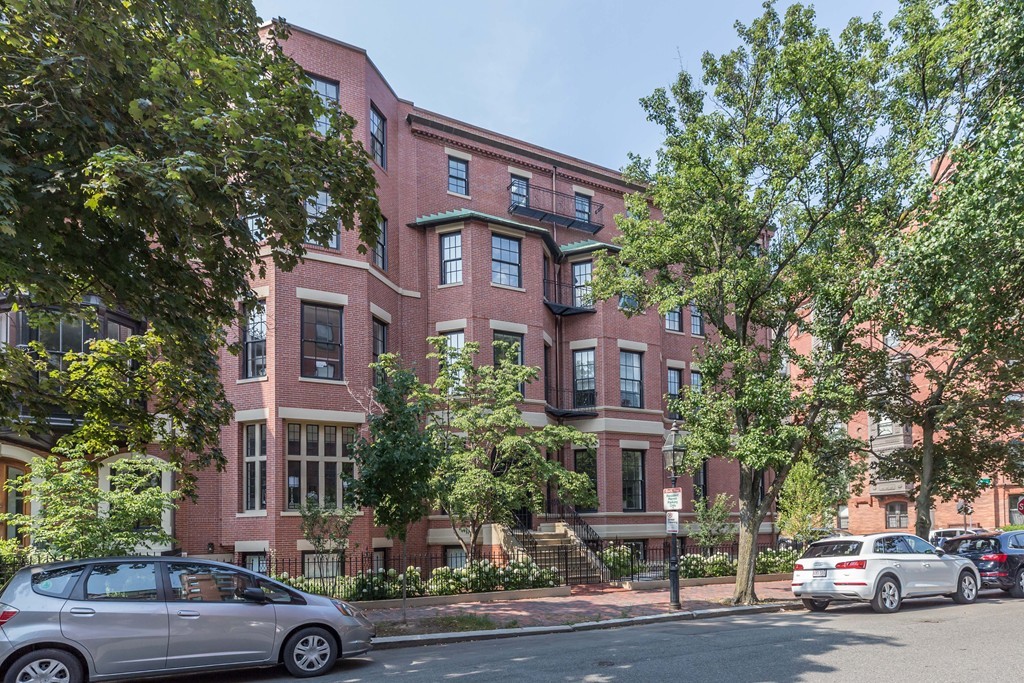 11 Exeter Street, Unit 3 Boston, MA 02116 - Photo 17 of 17 front view of a brick house with a street