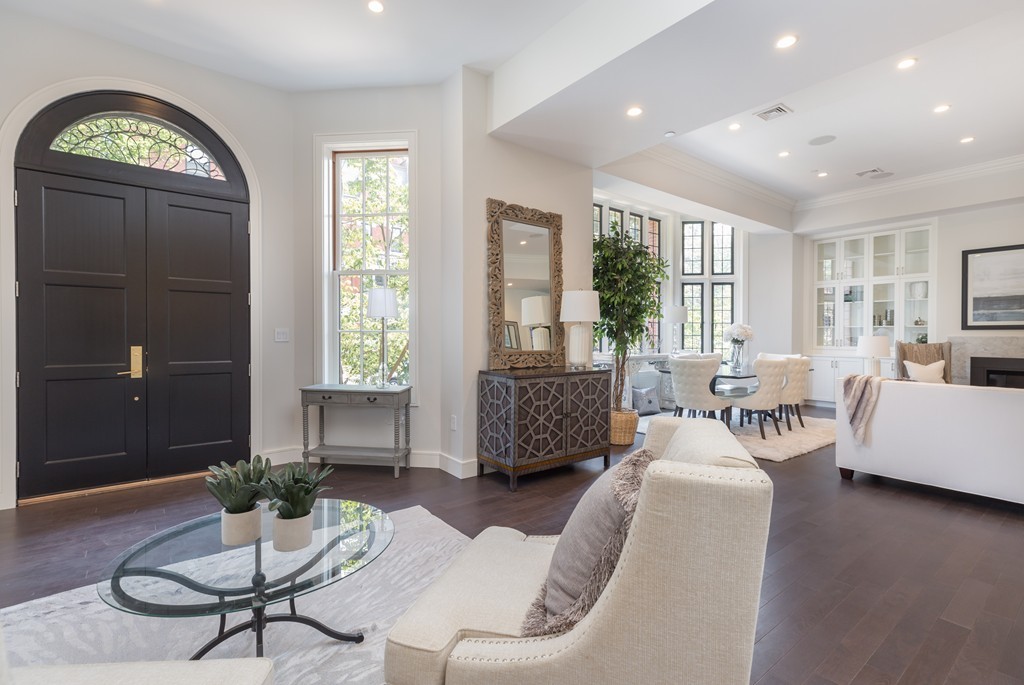 11 Exeter Street, Unit 3 Boston, MA 02116 - Photo 8 of 17 a living room with furniture and a large window