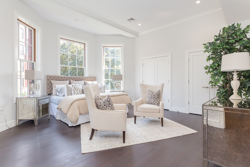 11 Exeter Street, Unit 3 Boston, MA 02116 - Photo 10 of 17 a living room with furniture and a large window