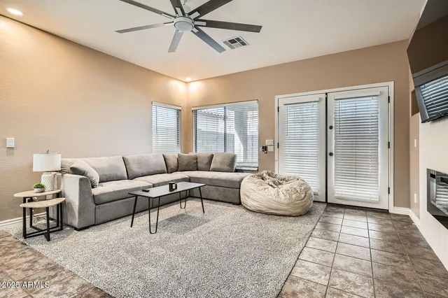 a living room with furniture and window