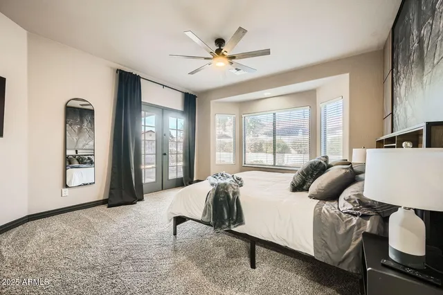 a bedroom with a bed and window