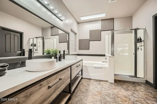 a bathroom with a double vanity sink mirror and shower