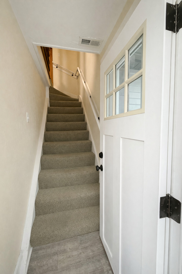 816 Fargo Boulevard, Unit 2 Geneva, IL 60134 - Photo 8 of 11 a view of staircase with white walls