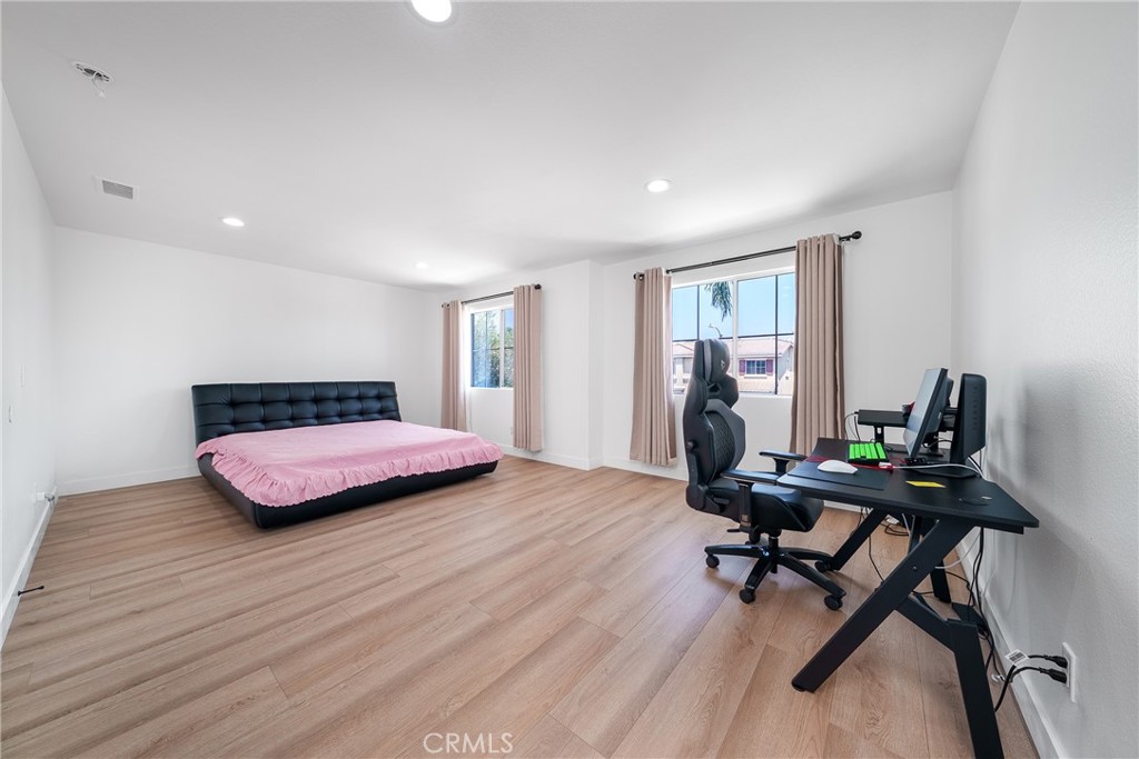 7358 Freedom Rancho Cucamonga, CA 91730 - Photo 22 of 34 a bedroom with a bed and a desk