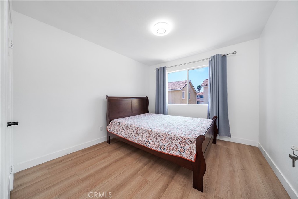 7358 Freedom Rancho Cucamonga, CA 91730 - Photo 24 of 34 a bedroom with a bed and window