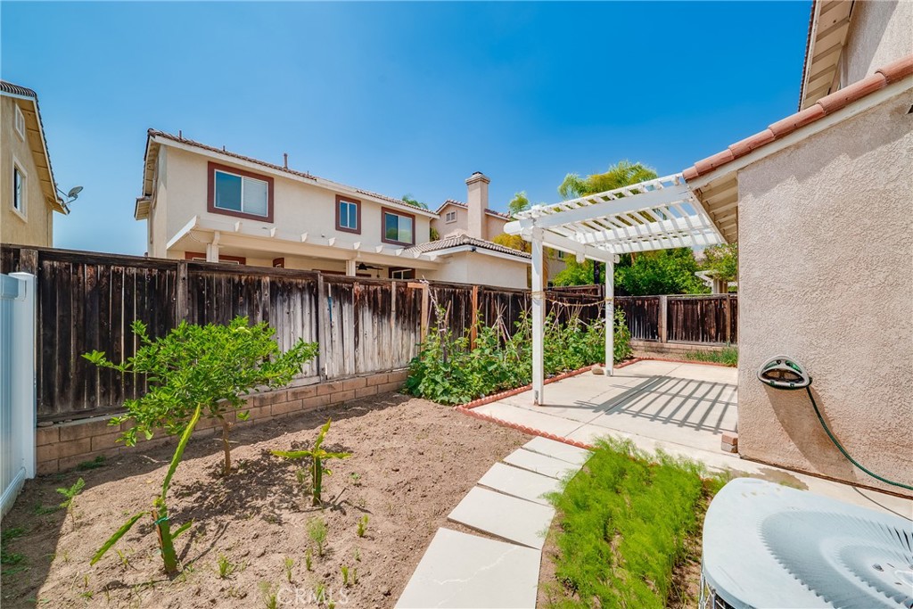 7358 Freedom Rancho Cucamonga, CA 91730 - Photo 29 of 34 a front view of a house with garden
