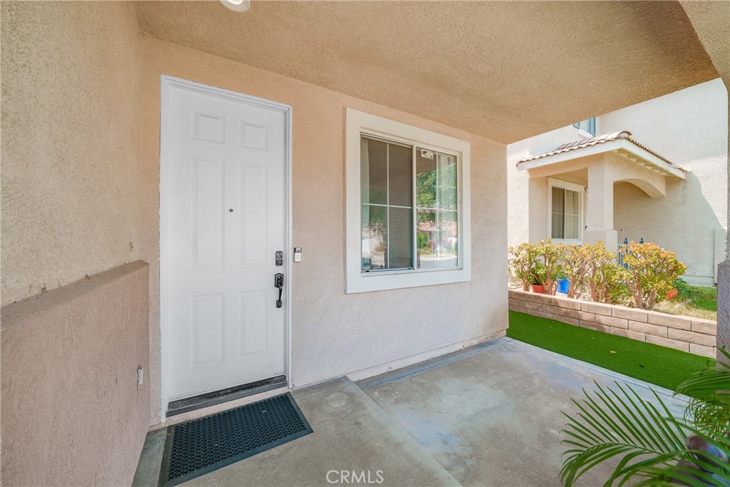 7358 Freedom Rancho Cucamonga, CA 91730 - Photo 7 of 34 a front view of a house with a yard