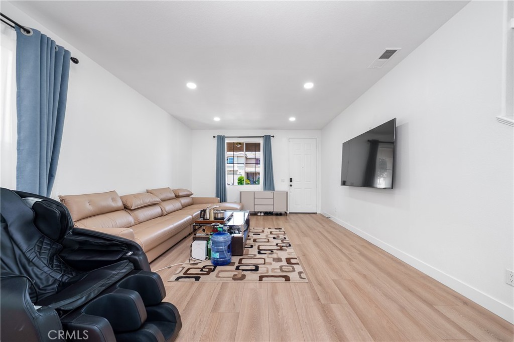 7358 Freedom Rancho Cucamonga, CA 91730 - Photo 10 of 34 a living room with furniture and a flat screen tv