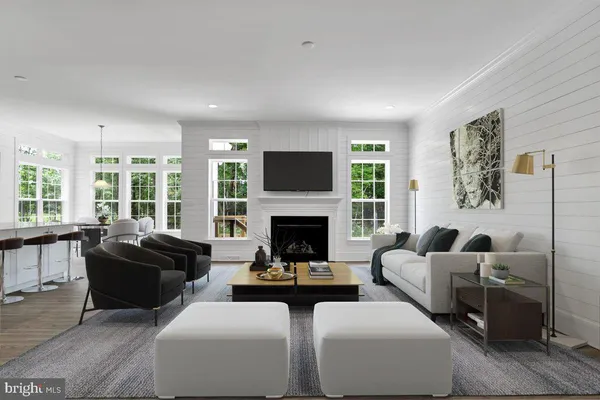 a living room with furniture fireplace and window
