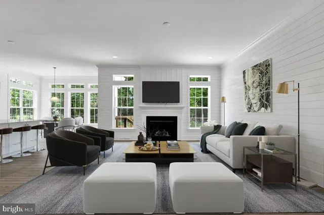 a living room with furniture fireplace and window