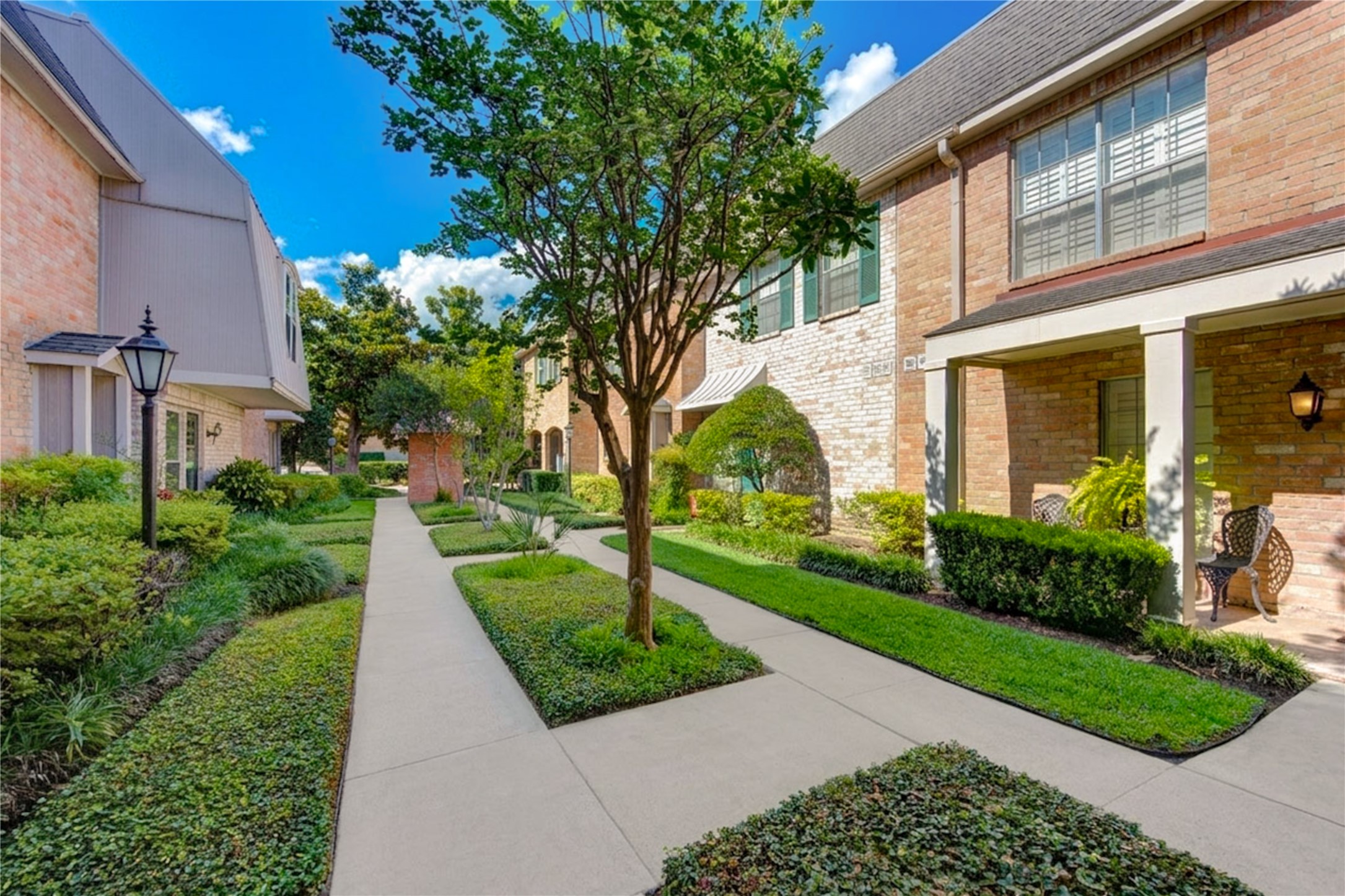 2232 South Piney Point Road, Unit 110 Houston, TX 77063 - Photo 18 of 21 Beautifully maintained community walkways with lush landscaping and peaceful green spaces provide a welcoming neighborhood feel.