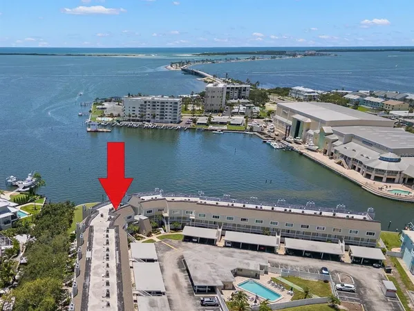 an aerial view of a house with a ocean view