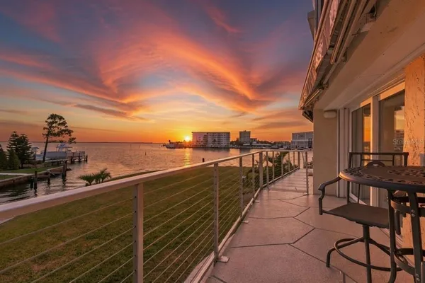 a view of a balcony with chairs