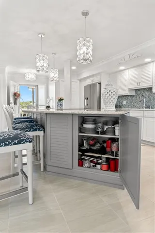 a kitchen with stainless steel appliances a sink and a stove