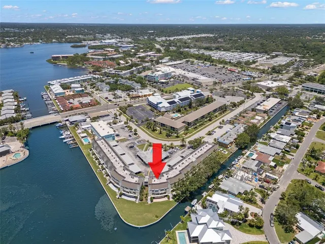 an aerial view of residential building and lake