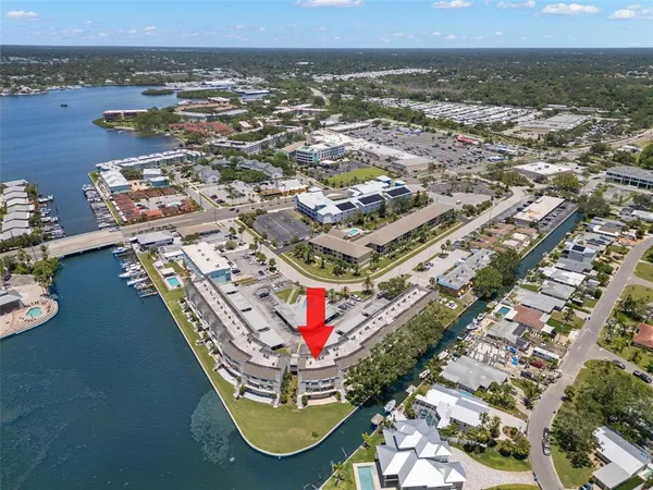 an aerial view of residential building and lake
