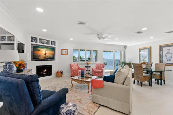 a living room with fireplace furniture and a flat screen tv