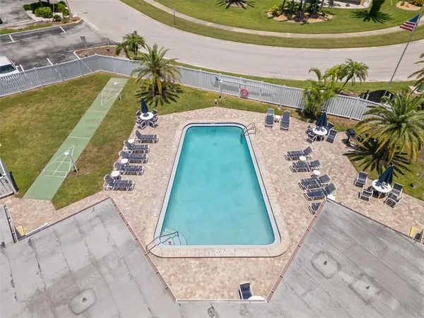 a view of swimming pool with sitting area