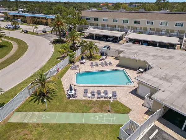 a view of a swimming pool with lounge chair