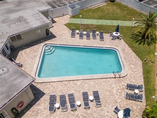 swimming pool view with a outdoor seating space