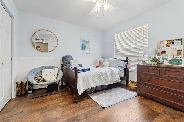 a bed room with a bed and a chandelier