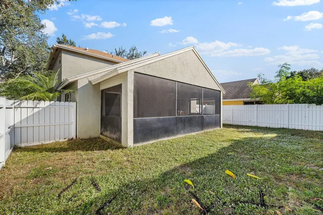 a backyard of a house with lots of green space