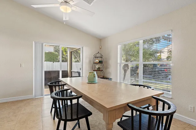 a view of a dining room with furniture window and outside view