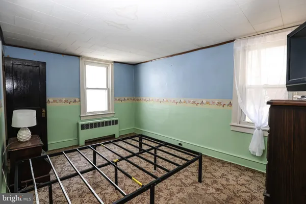 a room with washing machine and window