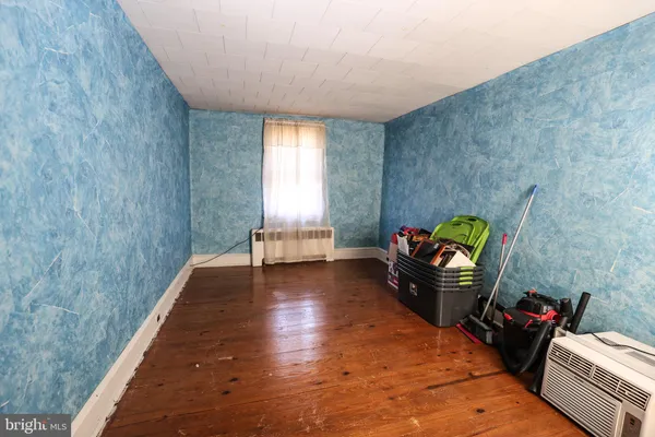 a living room with furniture and a gate