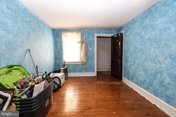a view of a livingroom with furniture and toys