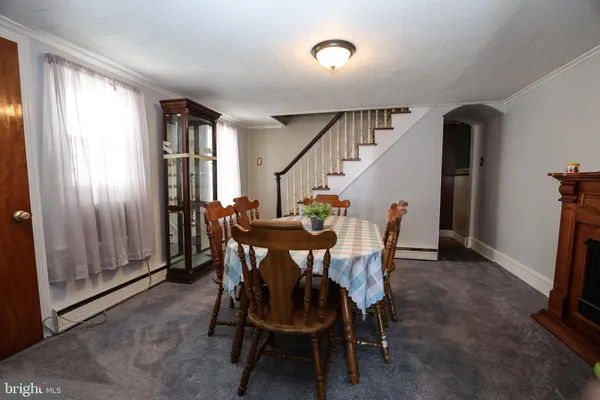 a dining room with furniture and window