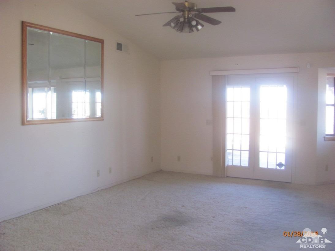 7078 Cascade Road Joshua Tree, CA 92252 - Photo 9 of 21 an empty room with a window