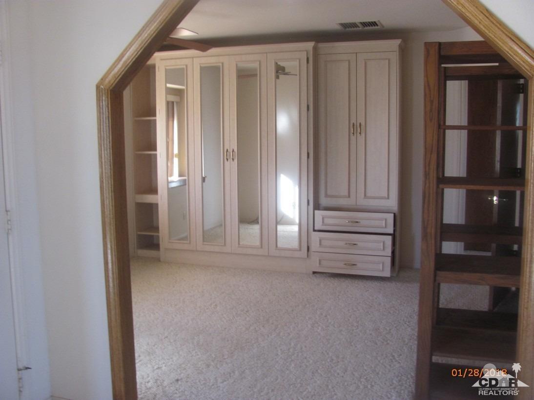 7078 Cascade Road Joshua Tree, CA 92252 - Photo 10 of 21 wooden floor and window in an empty room