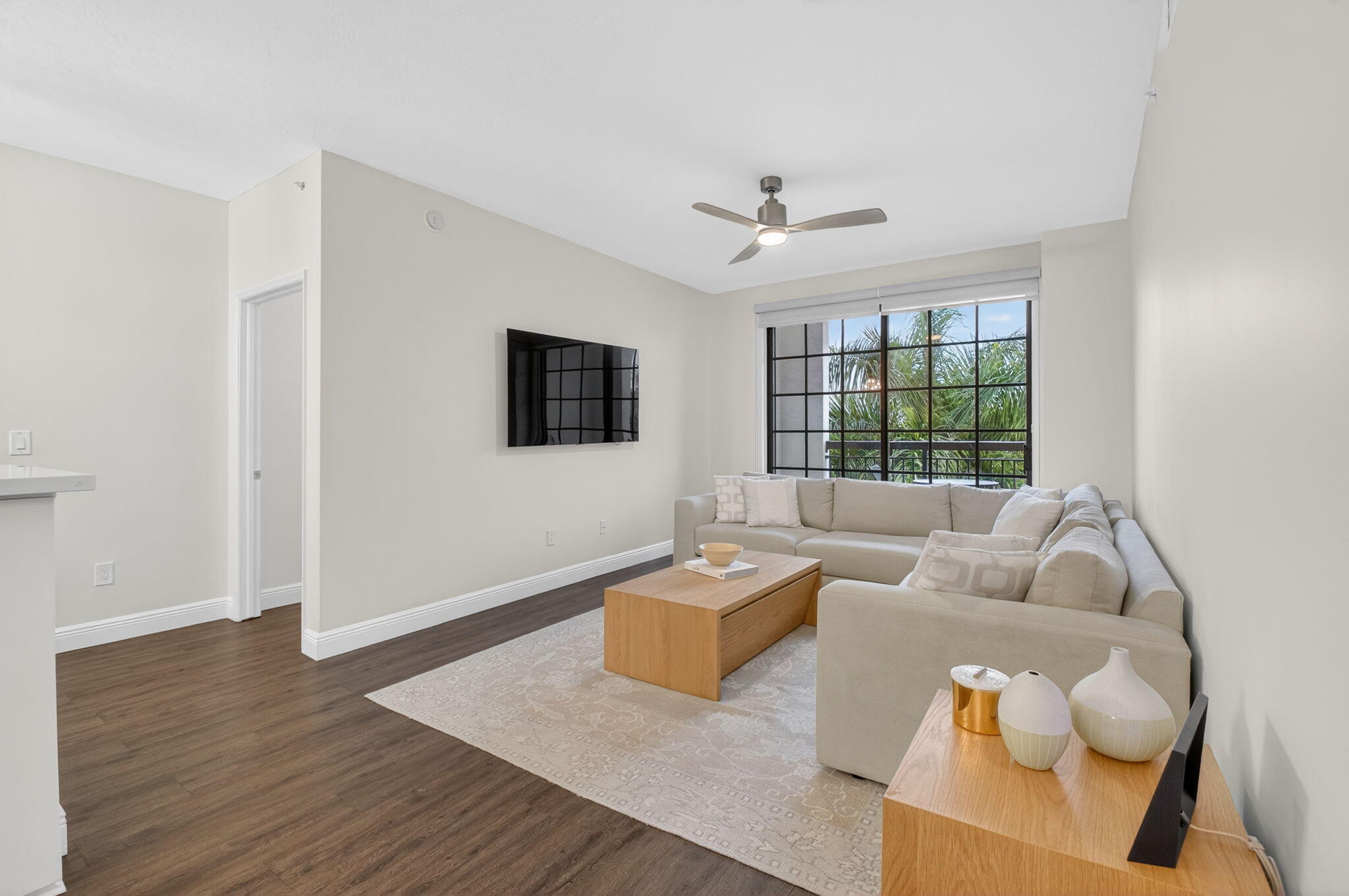 a living room with furniture and a flat screen tv